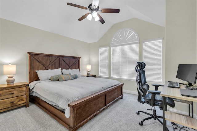 carpeted bedroom with ceiling fan and lofted ceiling