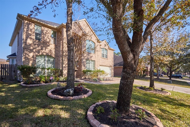 view of front of property with a front lawn and a garage