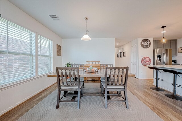 dining area with light wood-type flooring