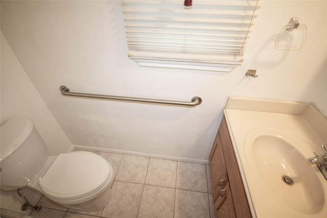 bathroom featuring vanity, toilet, and tile patterned floors