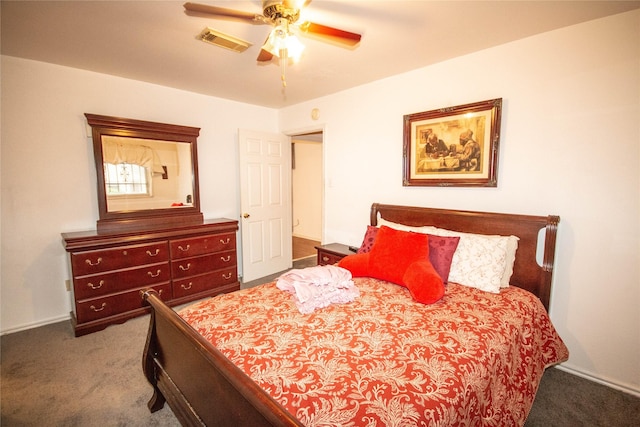 carpeted bedroom featuring visible vents and ceiling fan