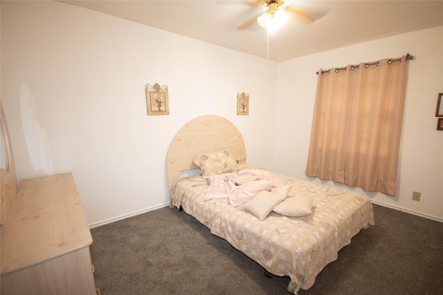 bedroom featuring dark carpet, baseboards, and ceiling fan