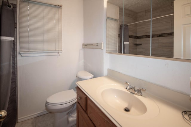 bathroom featuring toilet, a shower with shower curtain, tile patterned flooring, and vanity