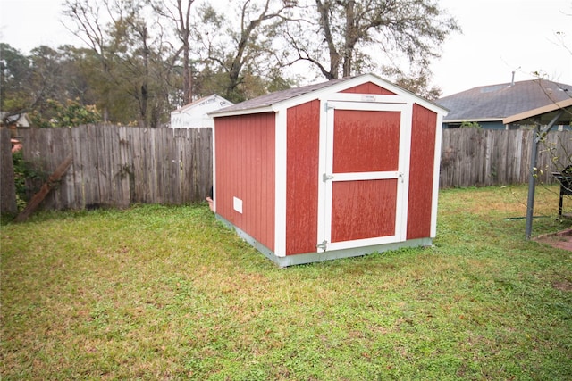 view of shed featuring a fenced backyard