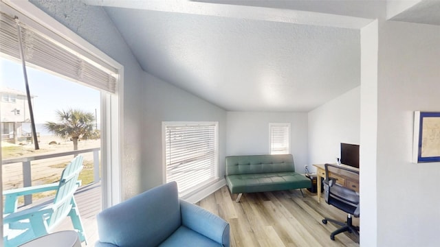 office area with a textured ceiling and light wood-type flooring