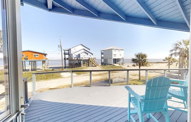 wooden deck featuring a water view