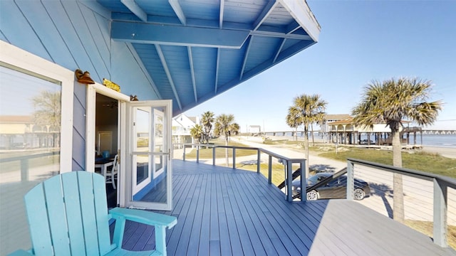 wooden deck featuring a water view