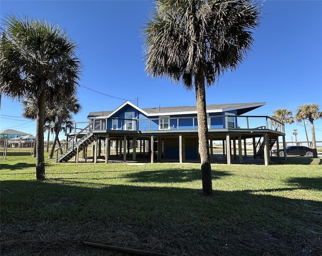 back of property featuring a lawn