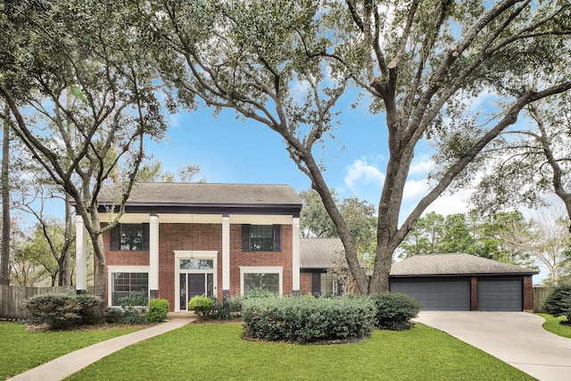 view of front facade with a garage and a front yard