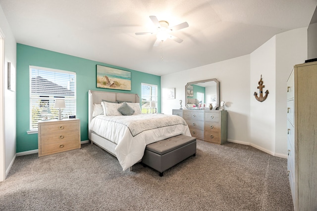 carpeted bedroom featuring vaulted ceiling and ceiling fan