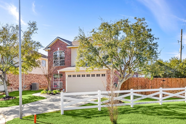 view of front of house featuring central air condition unit, a front lawn, and a garage