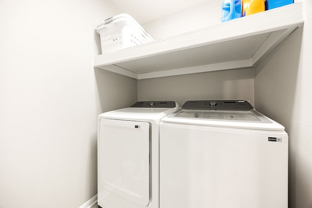 washroom with washer and clothes dryer