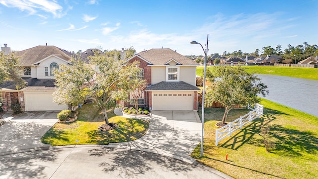 view of front of house with a front yard and a garage