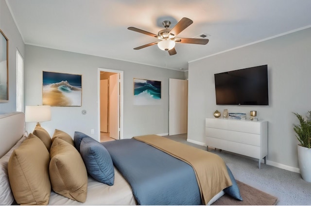 bedroom with ornamental molding and ceiling fan