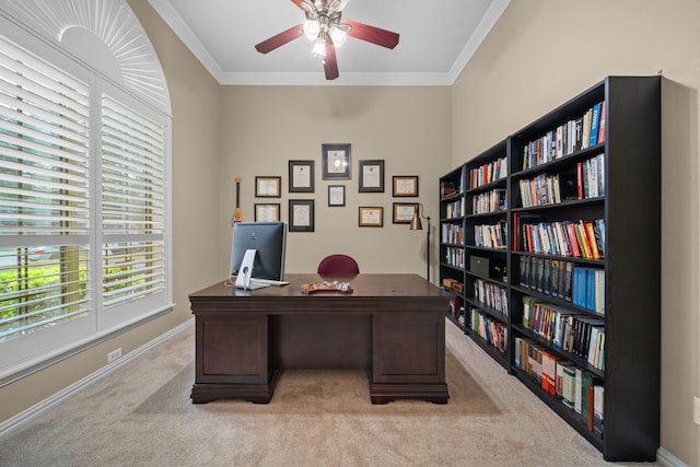 home office with ornamental molding, light colored carpet, and ceiling fan