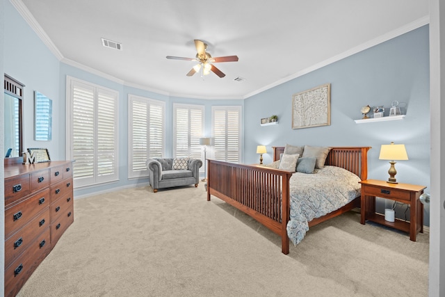 carpeted bedroom featuring ceiling fan and ornamental molding