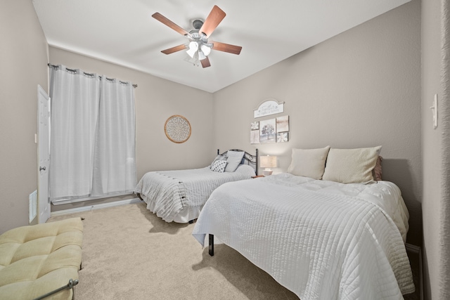 bedroom featuring ceiling fan and carpet flooring