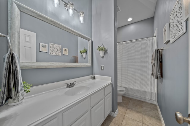 bathroom featuring toilet, tile patterned floors, and vanity