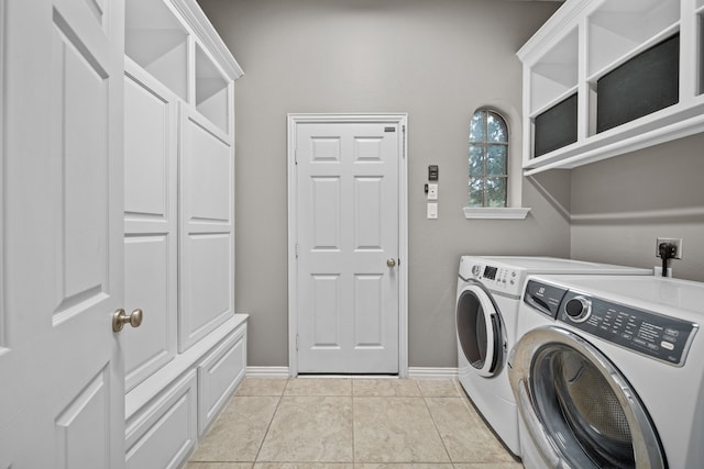 washroom featuring washer and dryer and light tile patterned floors