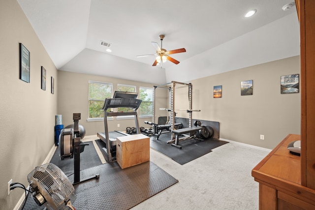 exercise room with lofted ceiling, ceiling fan, and carpet