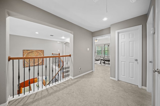 hallway with light colored carpet