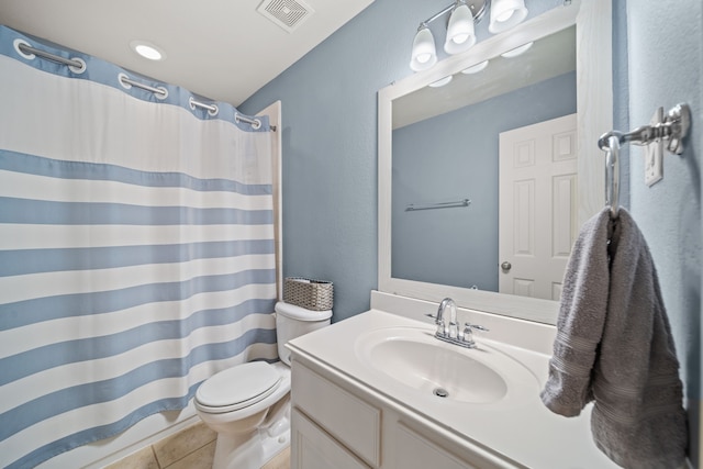 bathroom with vanity, tile patterned flooring, toilet, and curtained shower