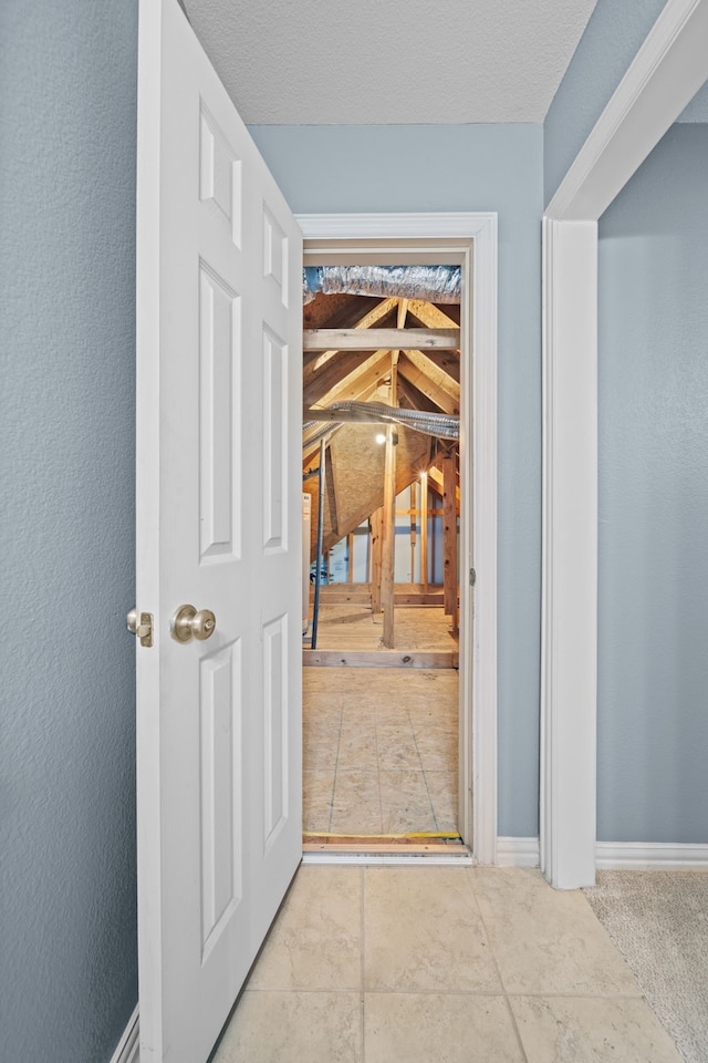 corridor featuring lofted ceiling