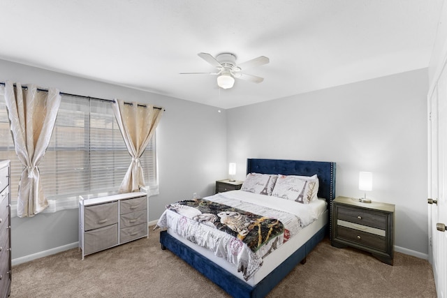 bedroom featuring ceiling fan and carpet