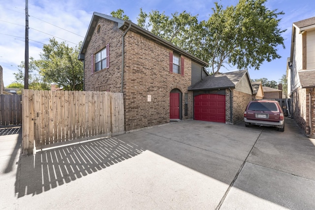 view of side of home featuring a garage