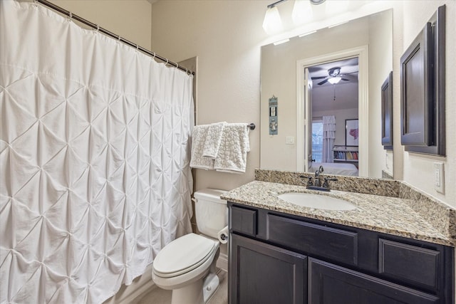 bathroom with ceiling fan, toilet, vanity, and a shower with shower curtain