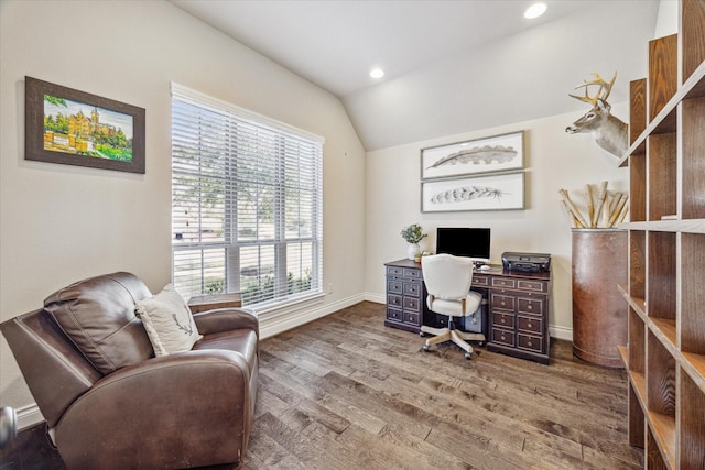 office space with vaulted ceiling and hardwood / wood-style flooring