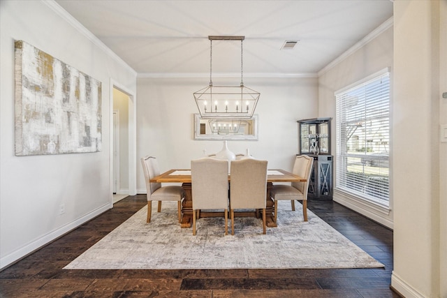 dining space with an inviting chandelier, dark hardwood / wood-style flooring, and ornamental molding