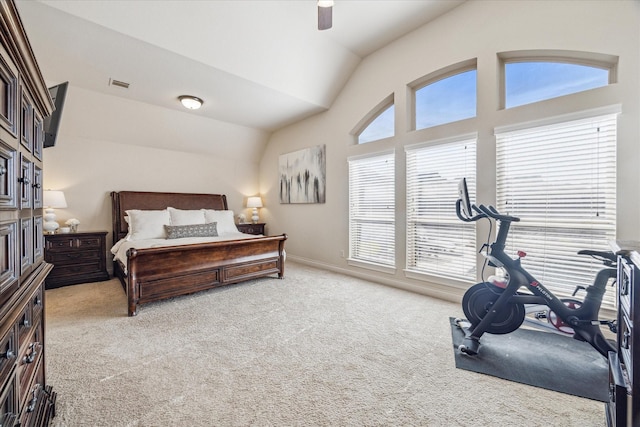 carpeted bedroom featuring vaulted ceiling and ceiling fan