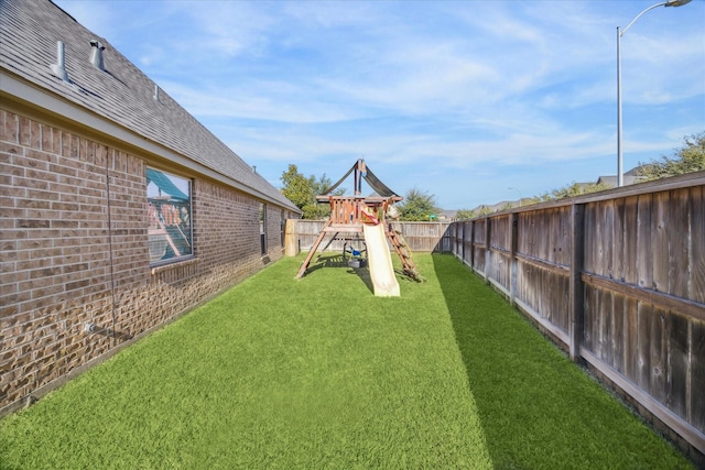 view of yard with a playground