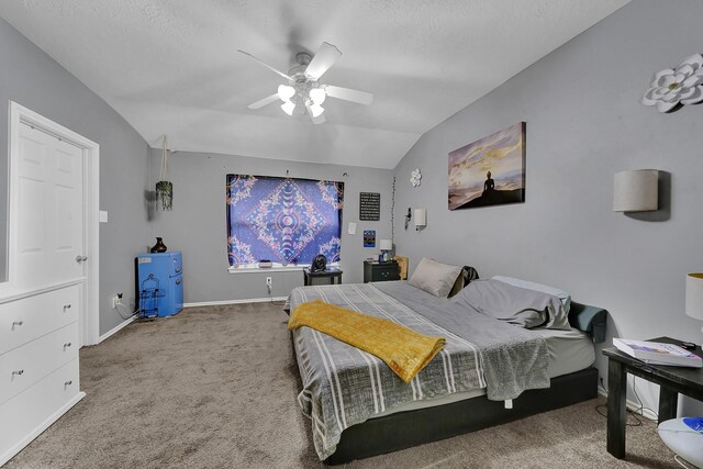 carpeted bedroom featuring a textured ceiling, ceiling fan, and vaulted ceiling