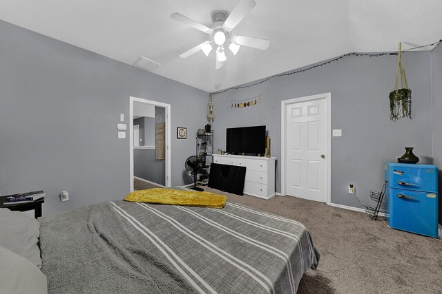 carpeted bedroom featuring vaulted ceiling and ceiling fan