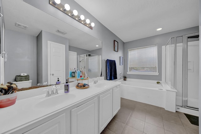 full bathroom with toilet, tile patterned flooring, vanity, and separate shower and tub