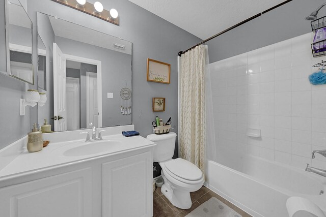 full bathroom with toilet, tile patterned flooring, shower / bath combo with shower curtain, and vanity