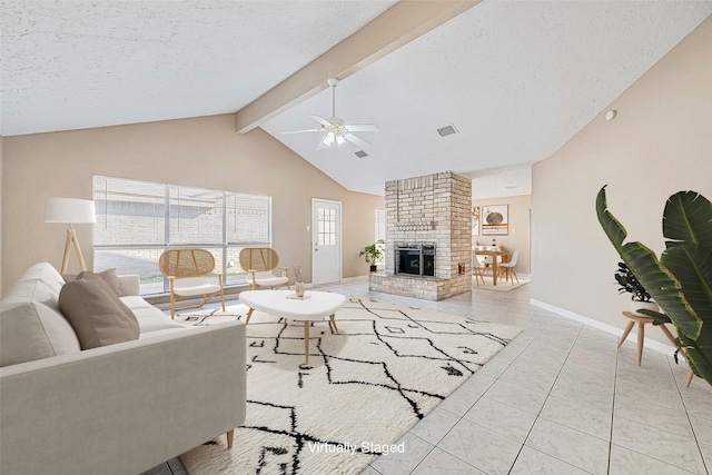 tiled living room featuring a brick fireplace, a textured ceiling, ceiling fan, and lofted ceiling with beams