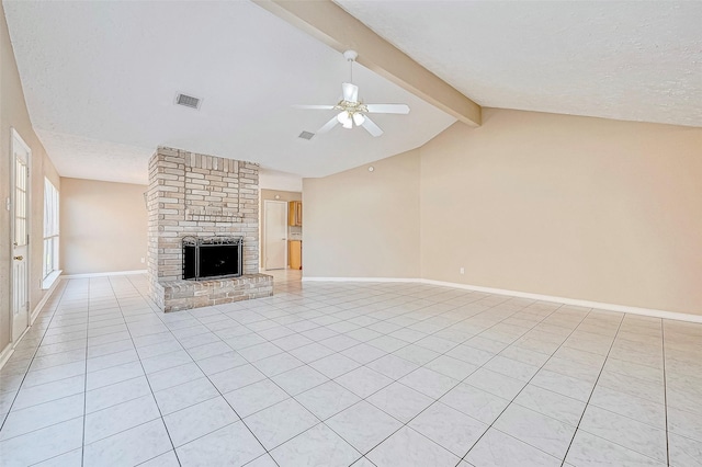 unfurnished living room featuring a textured ceiling, a fireplace, lofted ceiling with beams, and ceiling fan