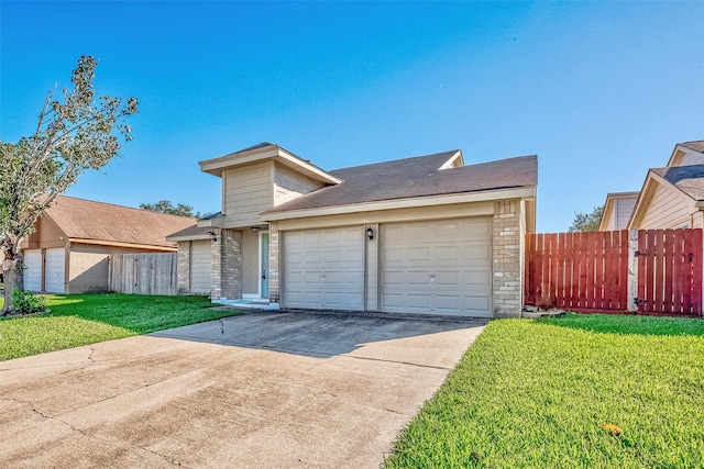 view of front facade with a garage and a front yard