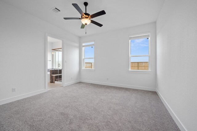 30551 Zoysia Point Ln, Fulshear, TX 77423 - unfurnished bedroom with light carpet, ensuite bathroom, and ceiling fan
