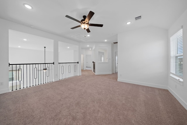 30551 Zoysia Point Ln, Fulshear, TX 77423 - empty room featuring ceiling fan, attic access, recessed lighting, and light colored carpet