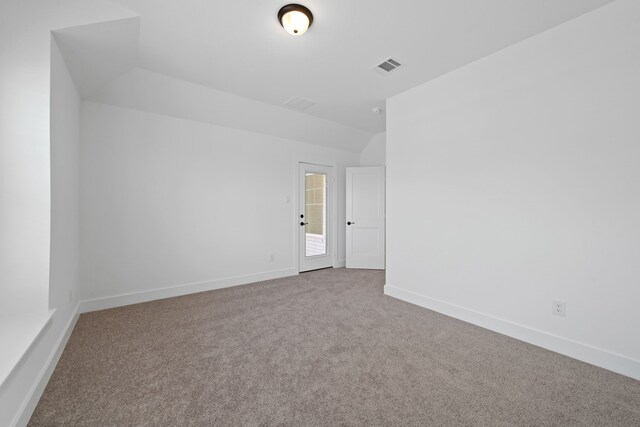 30551 Zoysia Point Ln, Fulshear, TX 77423 - empty room featuring carpet and lofted ceiling