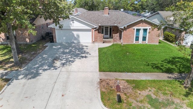 ranch-style home with a front lawn and a garage