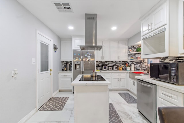 kitchen featuring sink, white cabinetry, a kitchen island, island range hood, and black appliances