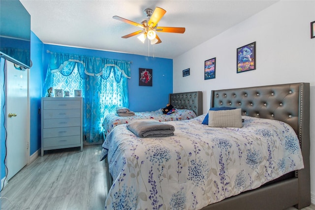 bedroom featuring ceiling fan and wood-type flooring