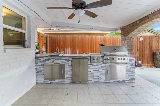 view of patio featuring a grill, ceiling fan, and area for grilling