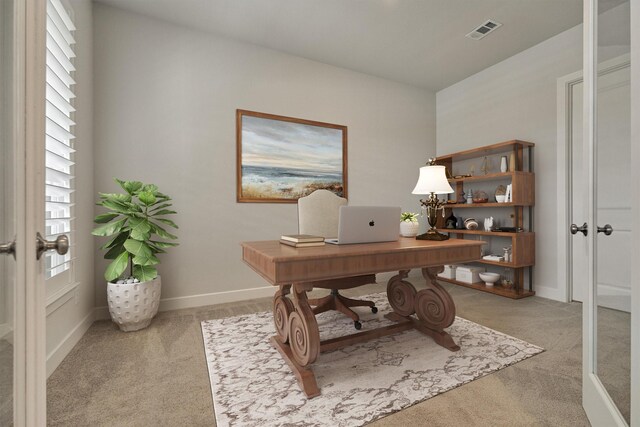 carpeted office space with french doors