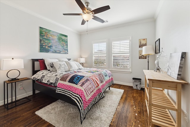 bedroom featuring dark hardwood / wood-style flooring, ceiling fan, and ornamental molding